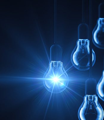 String of up close lightbulbs against a blue background