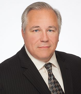 Professional headshot of attorney, John McCarron