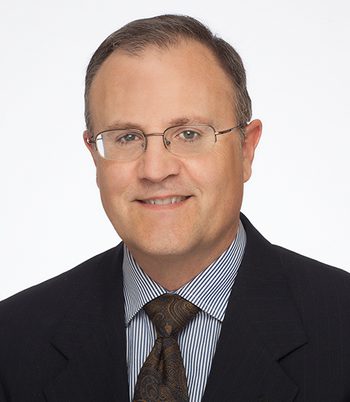 Professional headshot of attorney, Sil Reggiardo