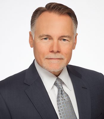 Professional headshot of attorney, William Warne