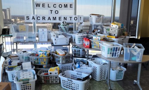 A photo of donation baskets and a sign that reads "welcome to Sacramento!"