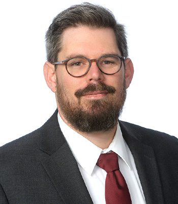 Professional headshot of attorney Sam Bacal-Graves