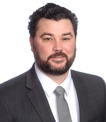 Professional headshot of attorney Dustin Peterson